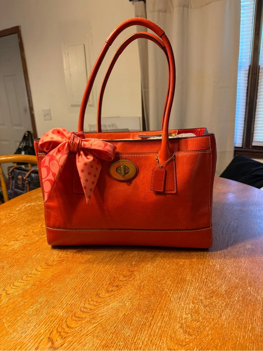 Coach Orange Leather Shoulder Bag with Pink Scarf Accent